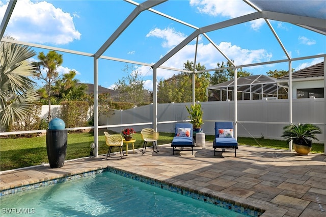 view of swimming pool with glass enclosure and a patio area