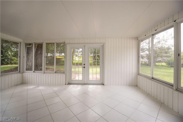 unfurnished sunroom featuring plenty of natural light and french doors