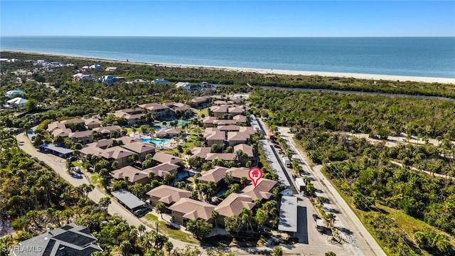 aerial view with a water view and a view of the beach