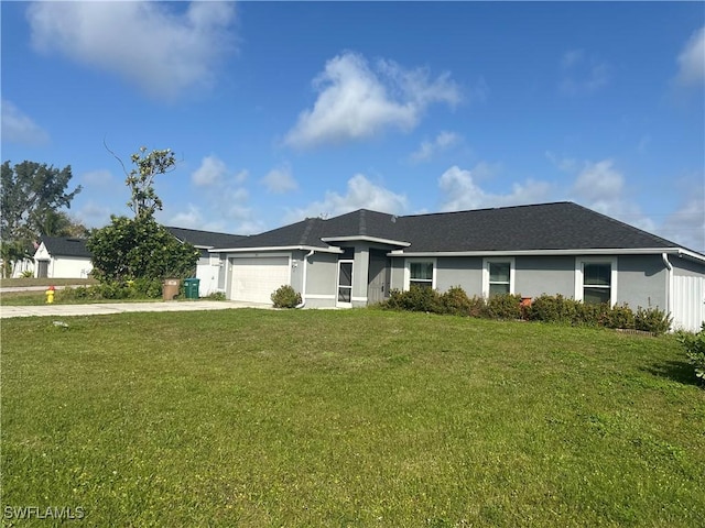 single story home featuring a garage and a front yard