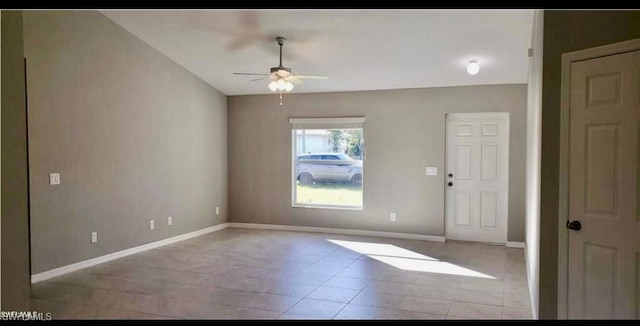 foyer featuring ceiling fan and light tile patterned floors