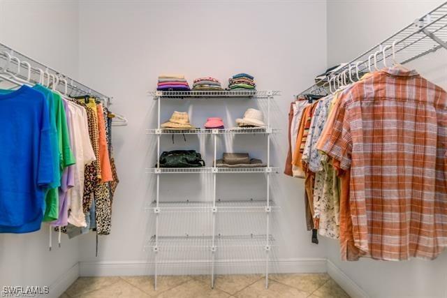 walk in closet featuring tile patterned flooring