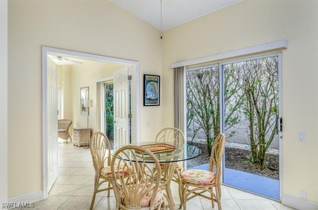 tiled dining room featuring ceiling fan