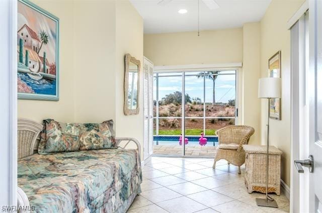 tiled bedroom featuring access to exterior and ceiling fan