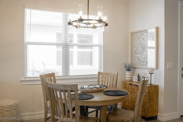 dining space featuring a notable chandelier