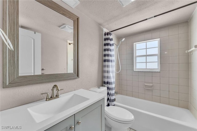 full bathroom featuring vanity, shower / bathtub combination with curtain, a textured ceiling, and toilet