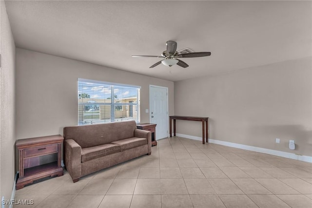 living area with light tile patterned flooring and ceiling fan