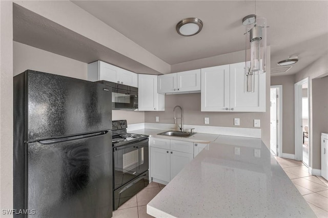 kitchen with white cabinetry, light stone countertops, sink, and black appliances