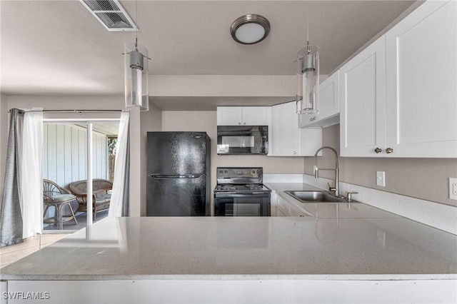 kitchen featuring sink, white cabinets, light stone counters, and black appliances