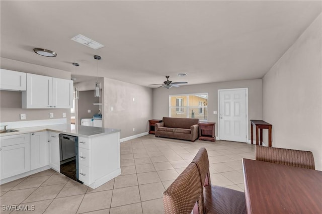 kitchen with white cabinetry, hanging light fixtures, kitchen peninsula, and dishwasher