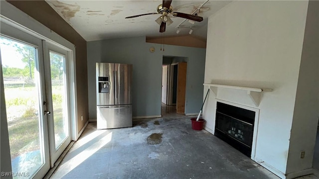 unfurnished living room with french doors, ceiling fan, lofted ceiling, and concrete flooring