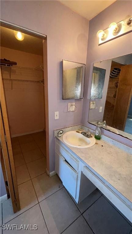 bathroom featuring vanity and tile patterned flooring