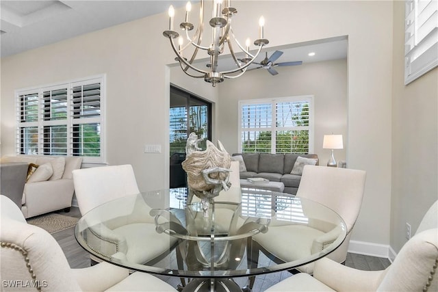 dining area featuring wood-type flooring and an inviting chandelier