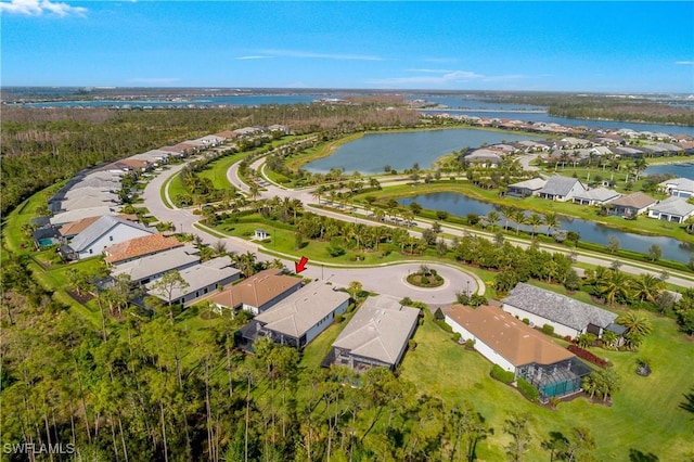 drone / aerial view with a water view