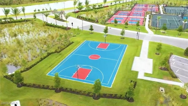 view of sport court featuring a water view