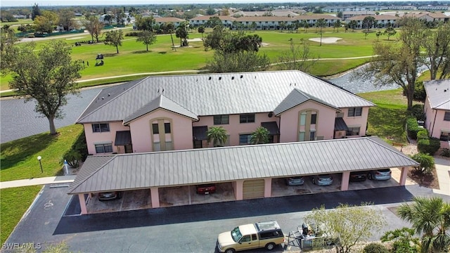 aerial view featuring a water view and golf course view