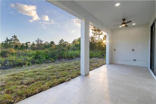 view of patio featuring ceiling fan