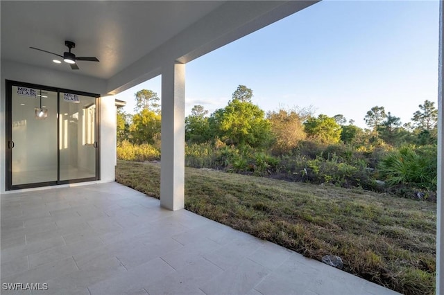 view of patio featuring ceiling fan