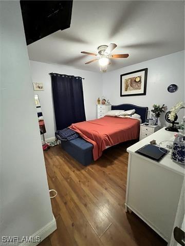 bedroom featuring dark wood-type flooring and ceiling fan