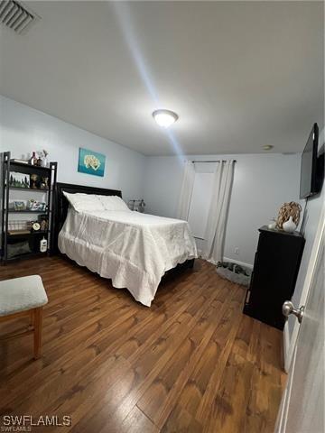 bedroom featuring dark hardwood / wood-style floors