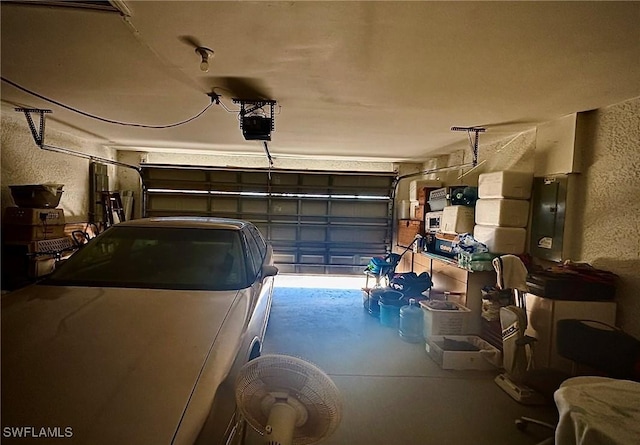 garage featuring a garage door opener and electric panel