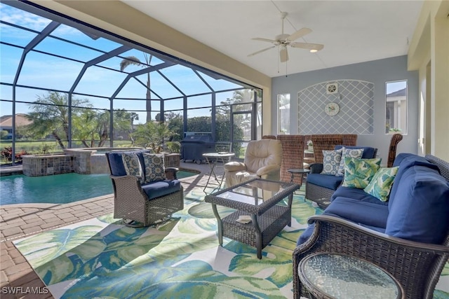 view of patio / terrace with an outdoor living space, ceiling fan, grilling area, and glass enclosure