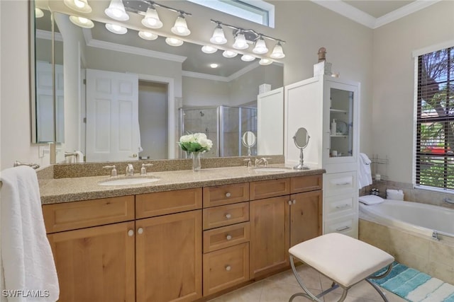 bathroom featuring tile patterned floors, vanity, crown molding, and shower with separate bathtub