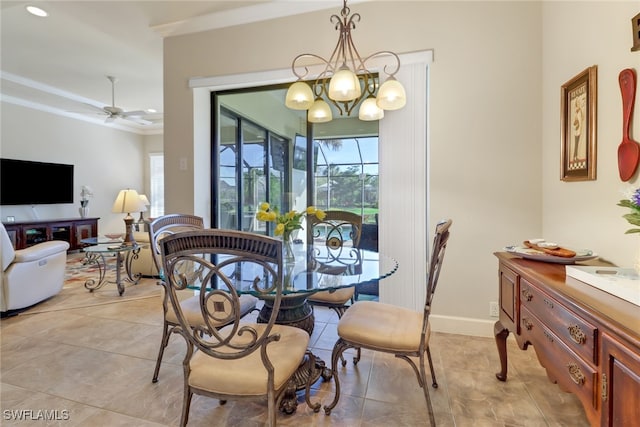 tiled dining room with ceiling fan and crown molding