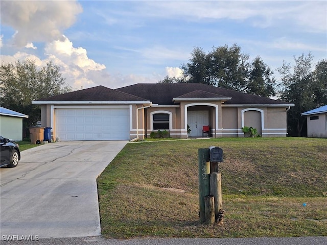 single story home featuring a garage and a front yard