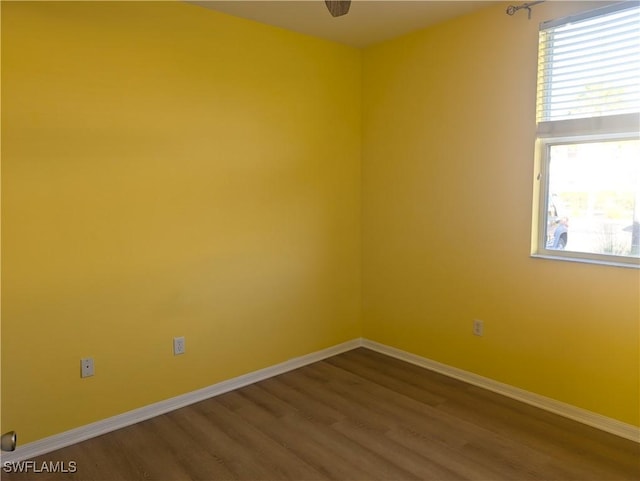 unfurnished room featuring wood-type flooring