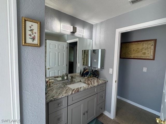 bathroom with vanity and tile patterned flooring