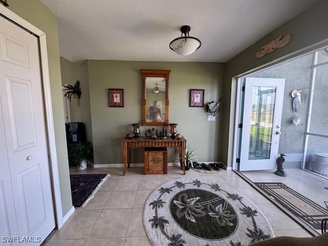 foyer entrance featuring light tile patterned floors