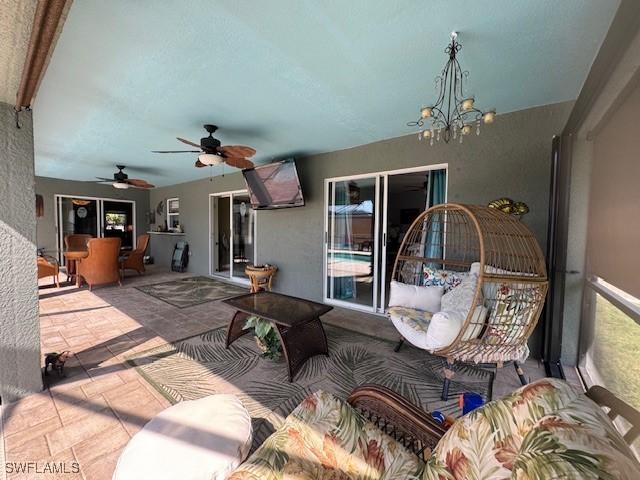 view of patio featuring ceiling fan