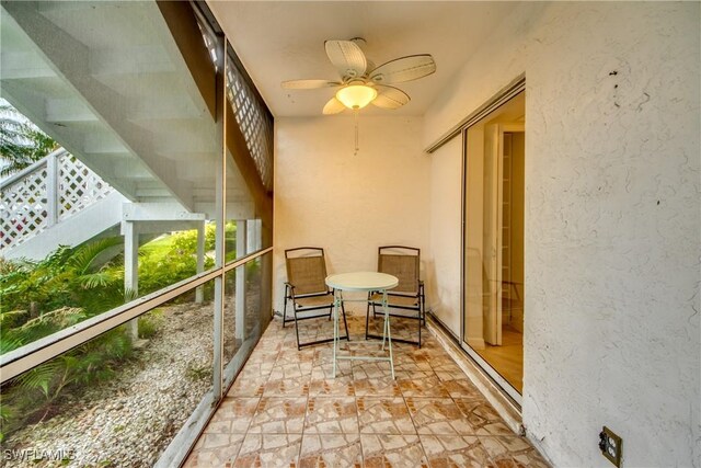 balcony featuring ceiling fan