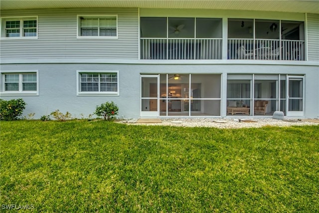 rear view of house with a yard