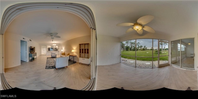 interior space with an outdoor kitchen and ceiling fan