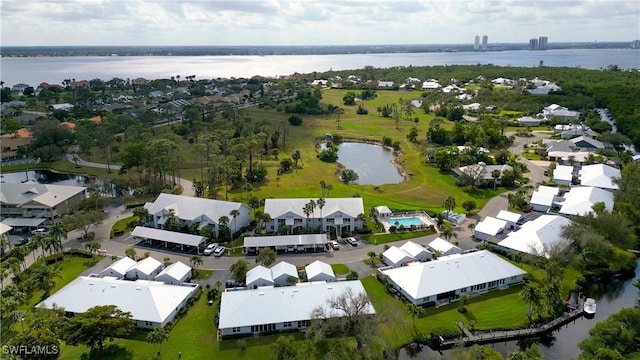 birds eye view of property with a water view