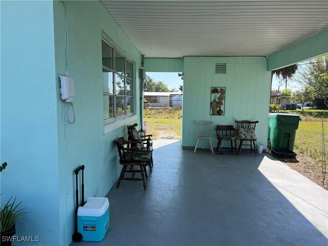 view of patio featuring a porch