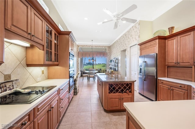 kitchen featuring stainless steel fridge, hanging light fixtures, a center island, black electric stovetop, and crown molding