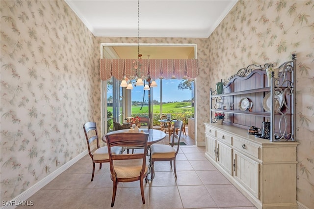 dining room featuring ornamental molding, light tile patterned floors, and a notable chandelier