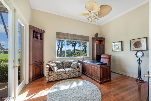 office space with crown molding, ceiling fan, and dark hardwood / wood-style floors