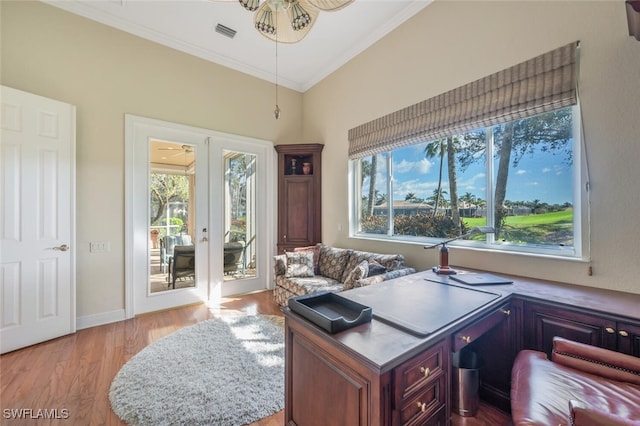 office area with french doors, crown molding, ceiling fan, and light hardwood / wood-style flooring