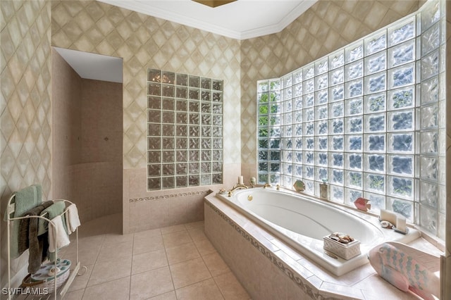 bathroom with crown molding, shower with separate bathtub, tile patterned flooring, and tile walls