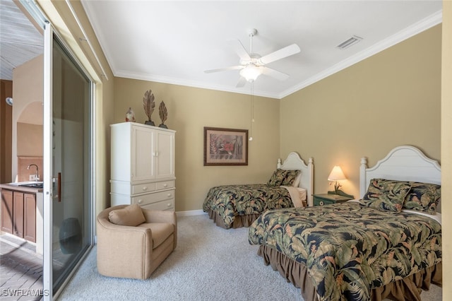 bedroom with sink, crown molding, light colored carpet, and ceiling fan