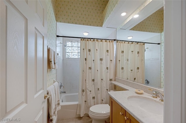 full bathroom with shower / bathtub combination with curtain, vanity, tile patterned flooring, and toilet