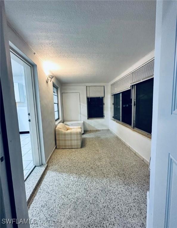 interior space featuring a textured ceiling