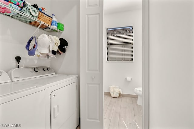 clothes washing area featuring washer and dryer