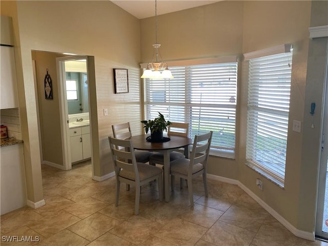 dining area featuring sink and a wealth of natural light