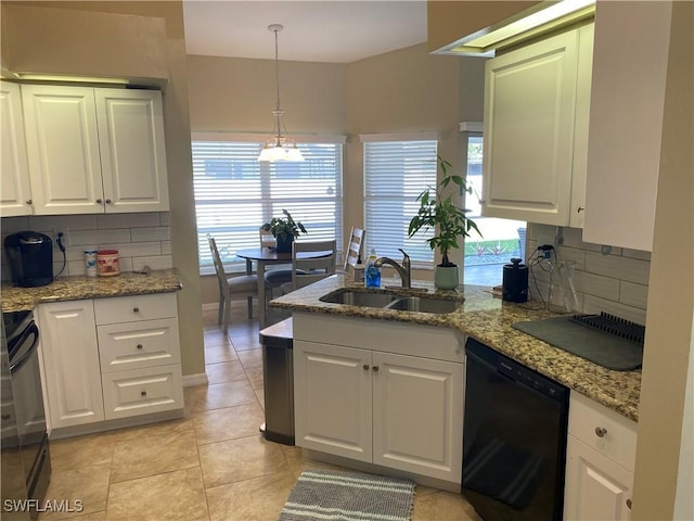 kitchen featuring decorative light fixtures, sink, white cabinets, light stone counters, and black appliances