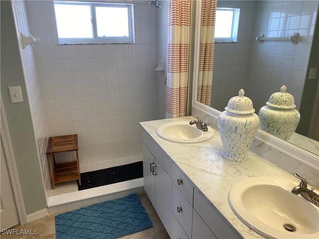 bathroom featuring vanity and a tile shower